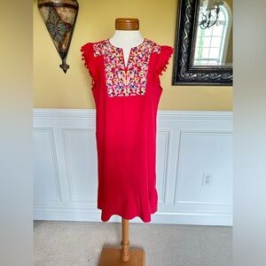 Red short ruffled bottom dress with colorful embroidered pattern. Size L.